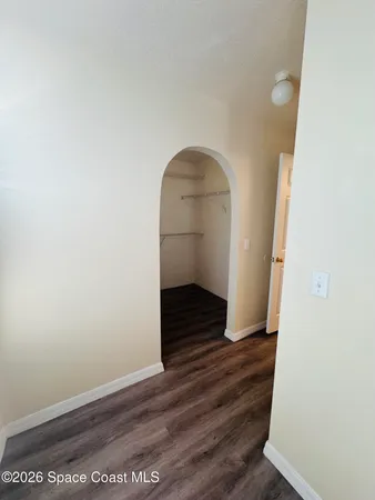 a view of entryway with wooden floor