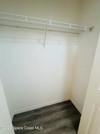 a view of a room with racks on the wall