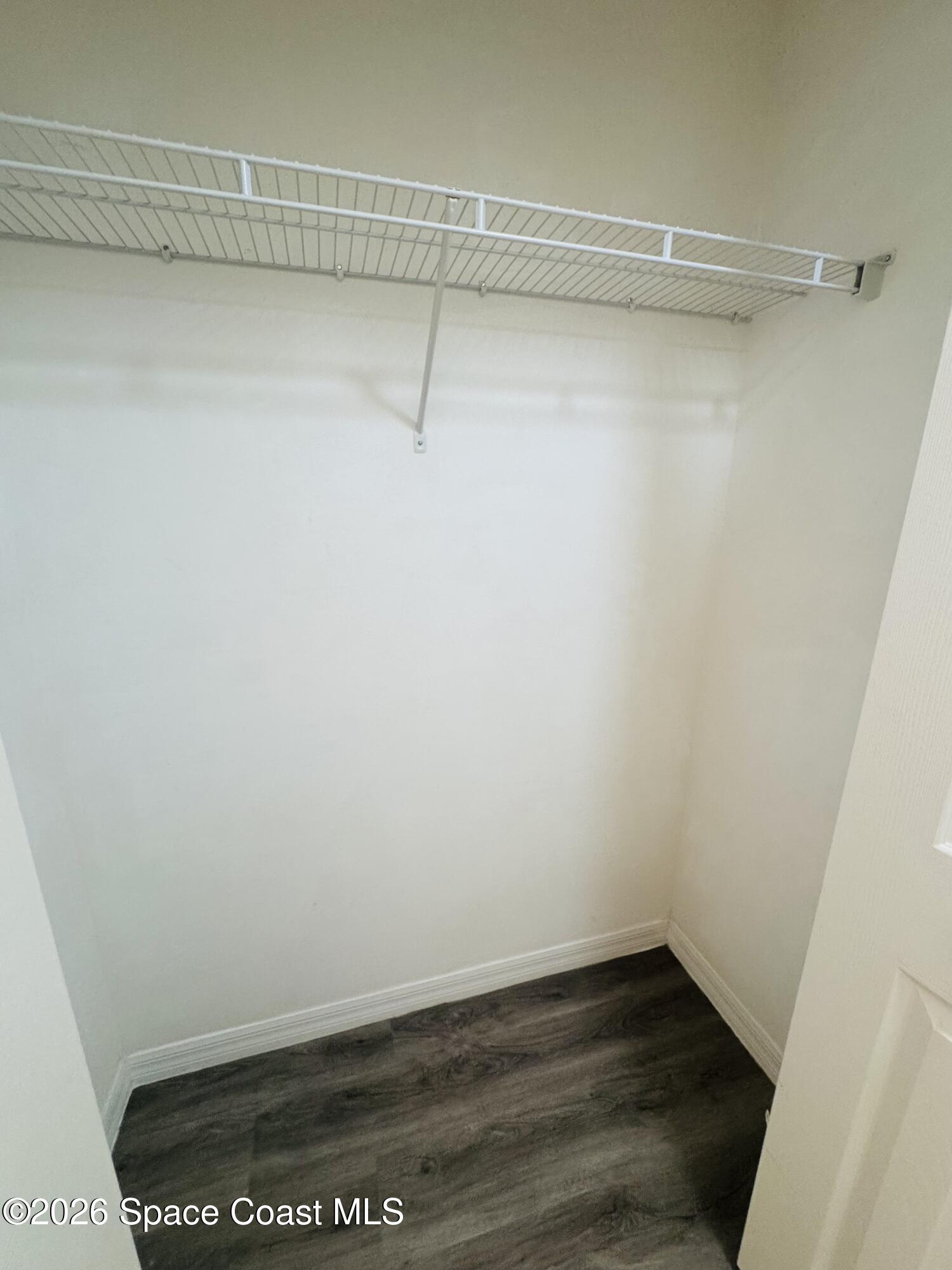 4550 Elena Way Melbourne, FL 32934 - Photo 19 of 33 a view of a room with racks on the wall