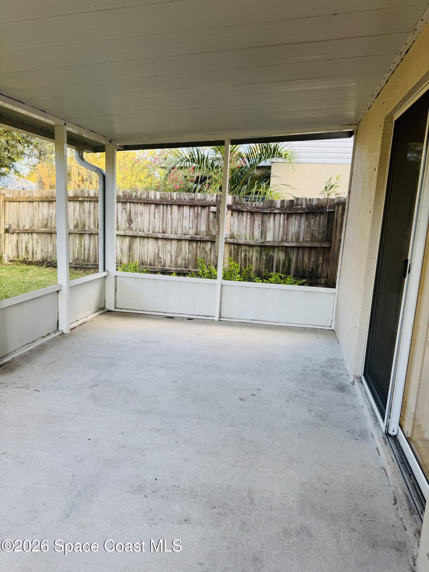 4550 Elena Way Melbourne, FL 32934 - Photo 24 of 33 a view of empty room with floor to ceiling window