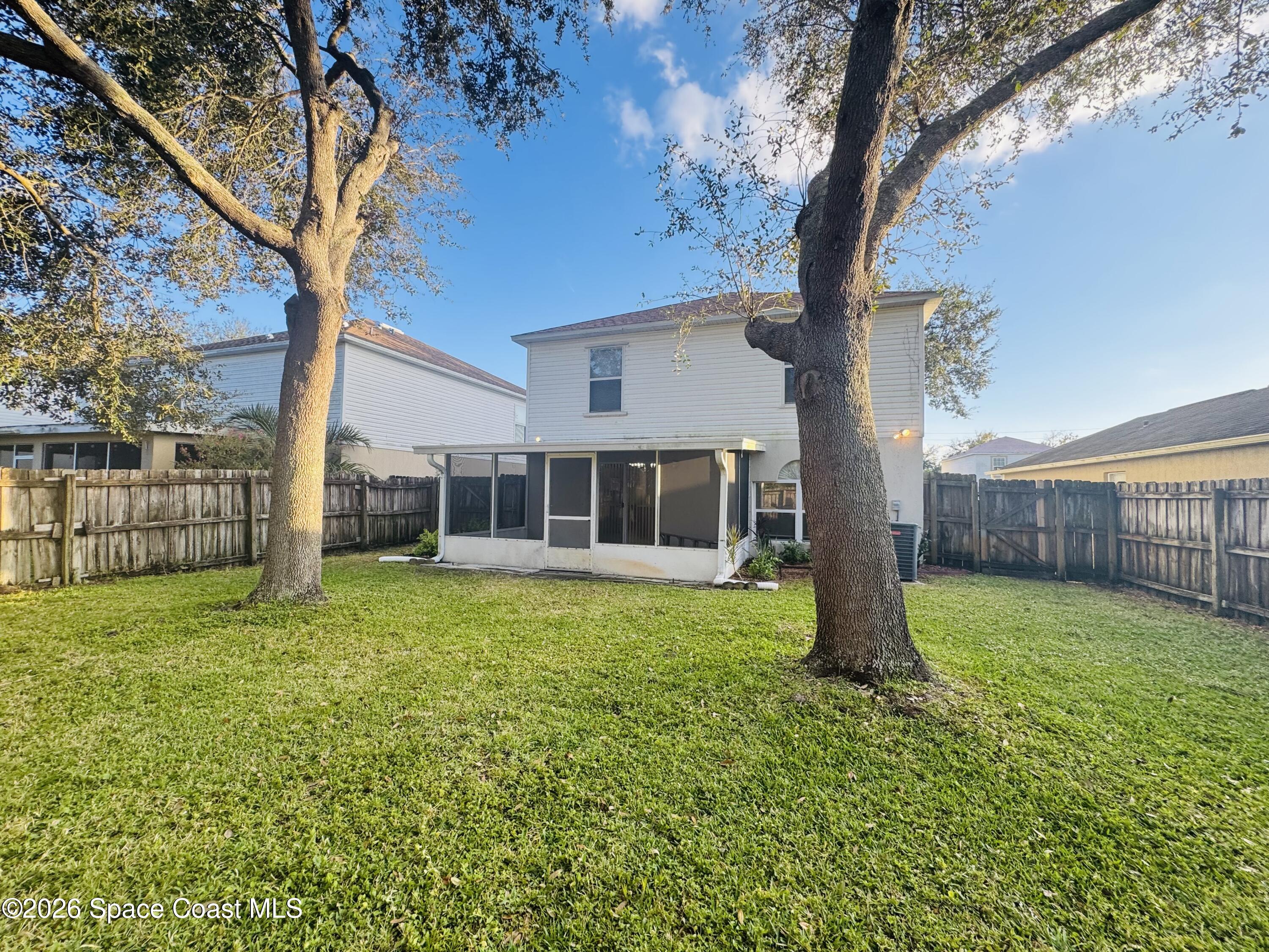 4550 Elena Way Melbourne, FL 32934 - Photo 26 of 33 a view of a house with a yard