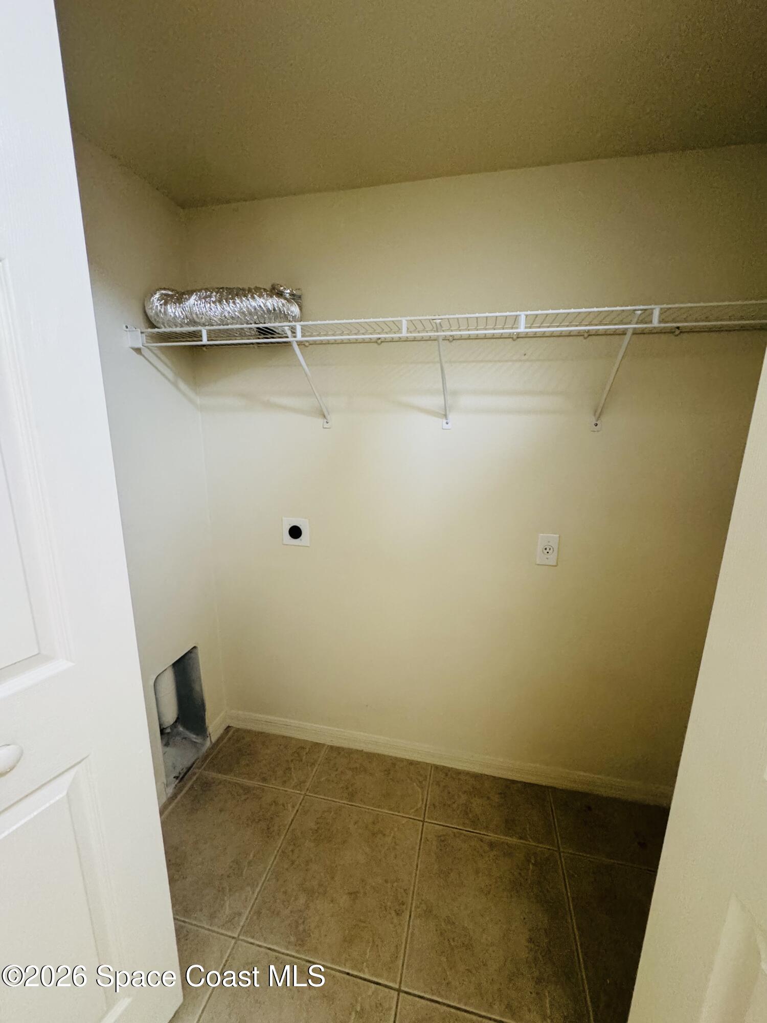 4550 Elena Way Melbourne, FL 32934 - Photo 29 of 33 a view of a room with racks on the wall