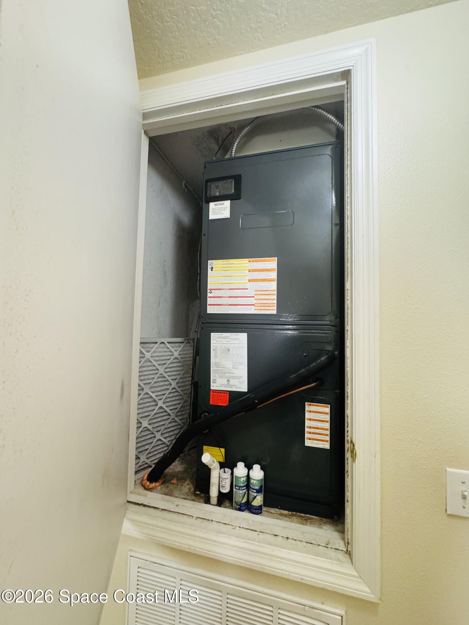 4550 Elena Way Melbourne, FL 32934 - Photo 30 of 33 a bathroom with a mirror and a sink