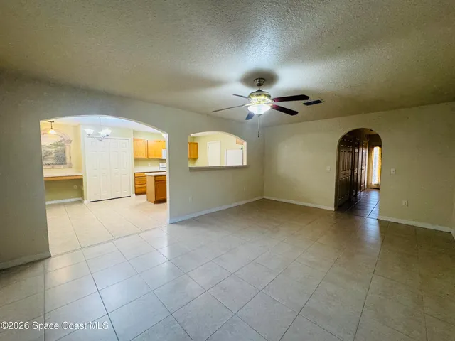 a view of empty room with a fireplace