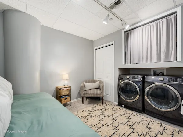 a bedroom with bed and a window