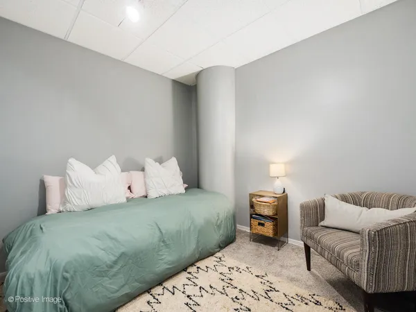 a bedroom with a bed and a couch
