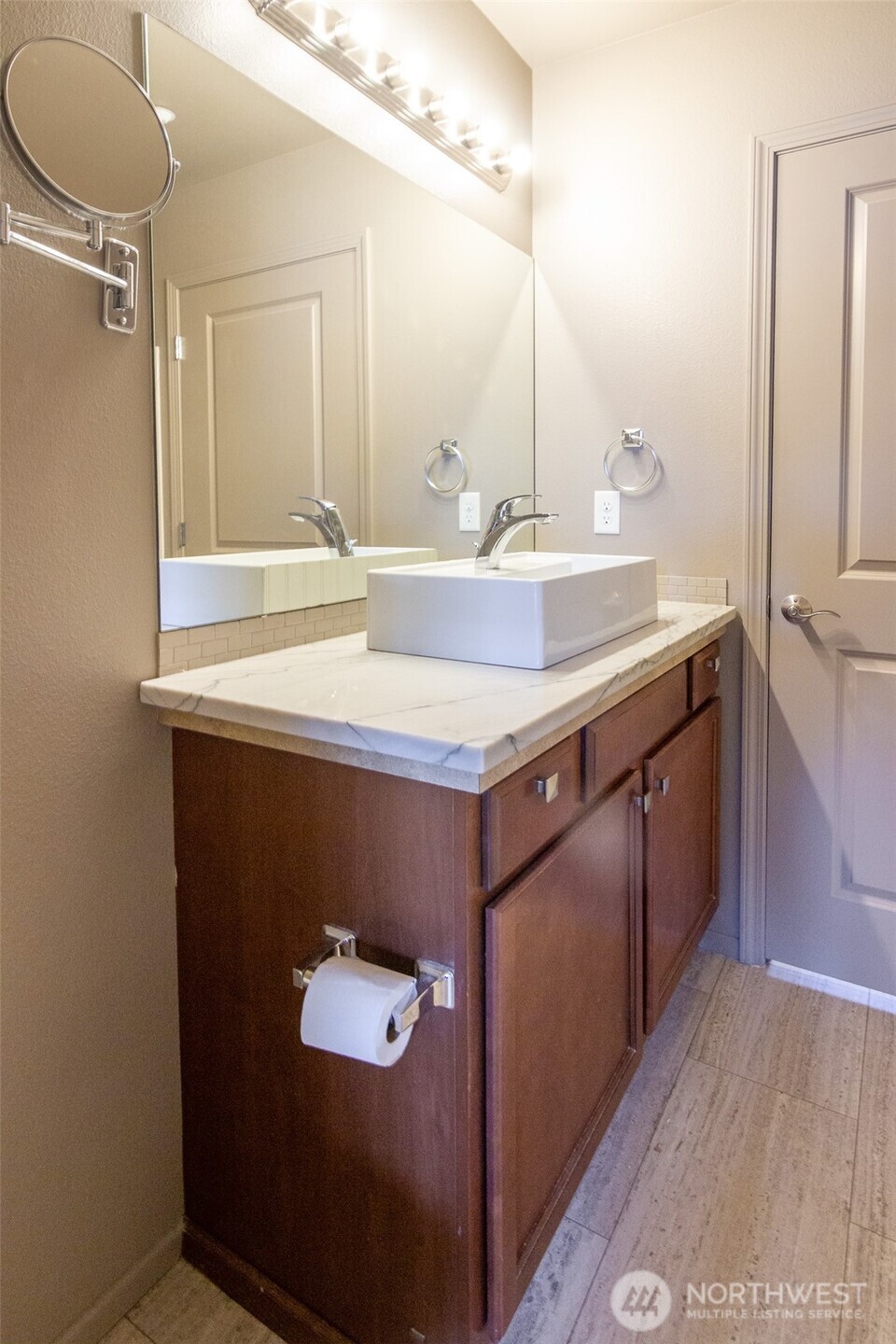 5686 Correll Drive, Unit 101 Ferndale, WA 98248 - Photo 17 of 22 a bathroom with a sink vanity and a mirror
