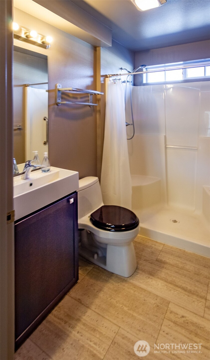 5686 Correll Drive, Unit 101 Ferndale, WA 98248 - Photo 19 of 22 a bathroom with a sink a toilet and shower