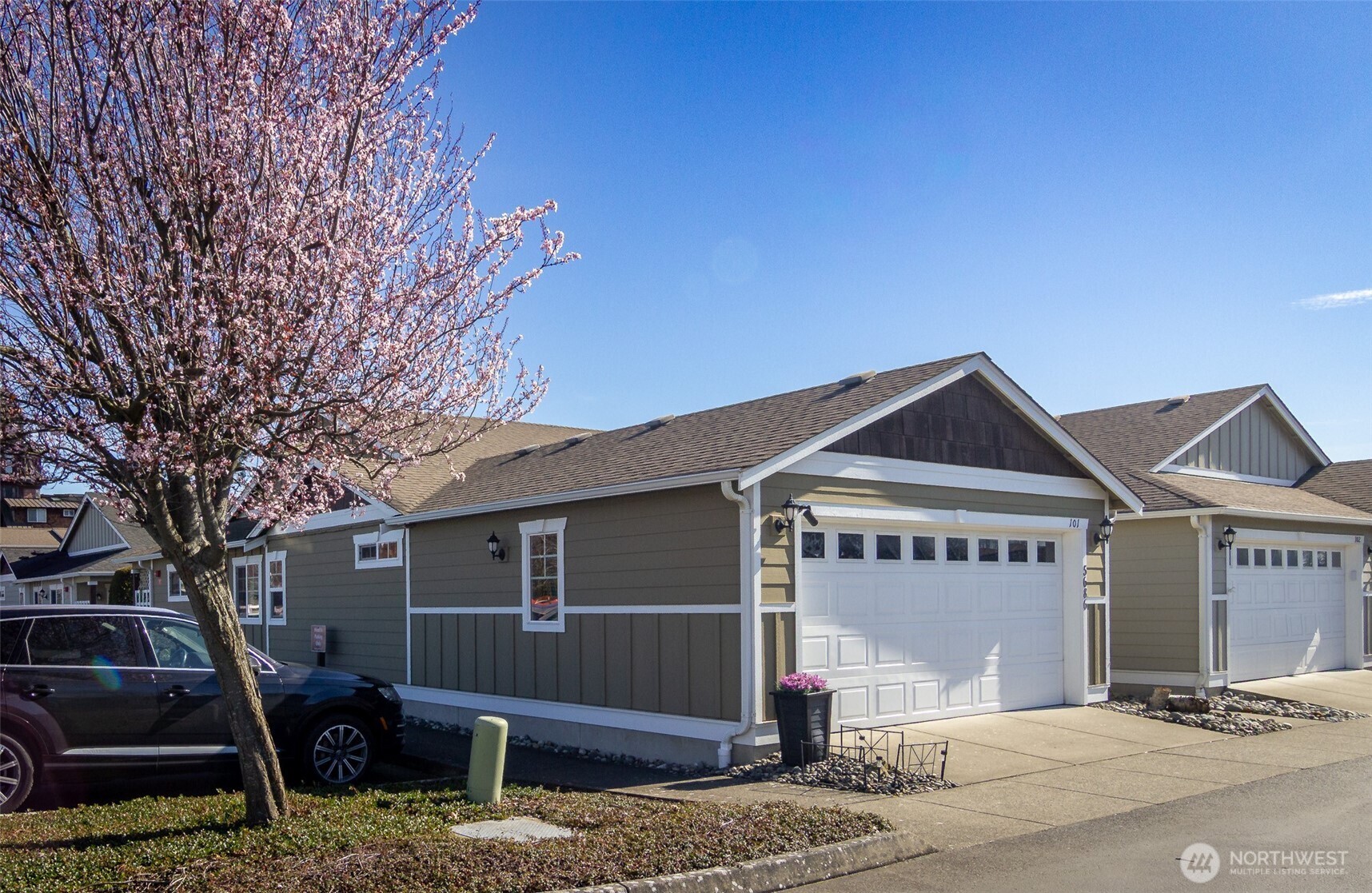 5686 Correll Drive, Unit 101 Ferndale, WA 98248 - Photo 20 of 22 a front view of a house with a yard