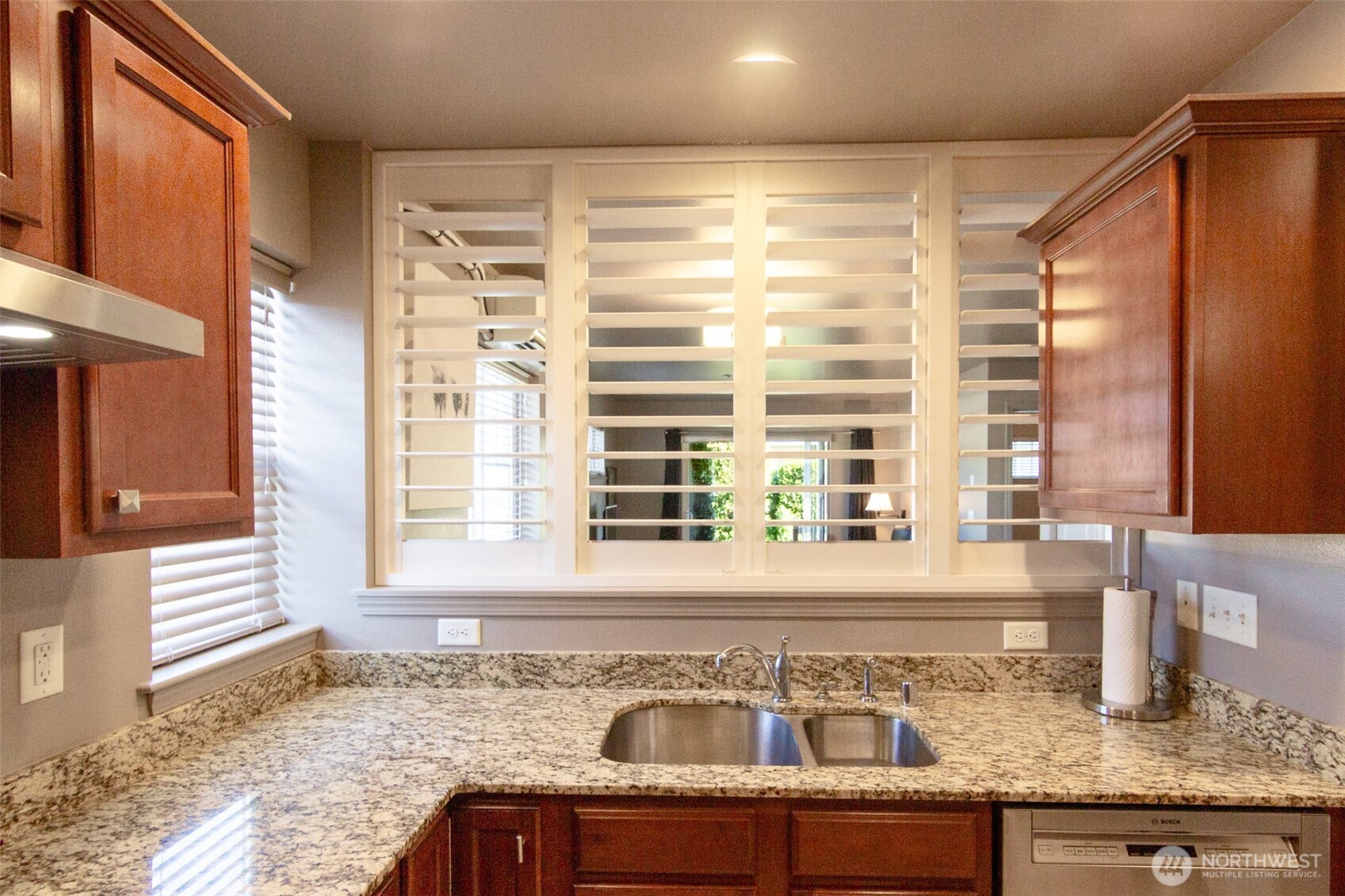 5686 Correll Drive, Unit 101 Ferndale, WA 98248 - Photo 5 of 22 a kitchen with granite countertop sink and window