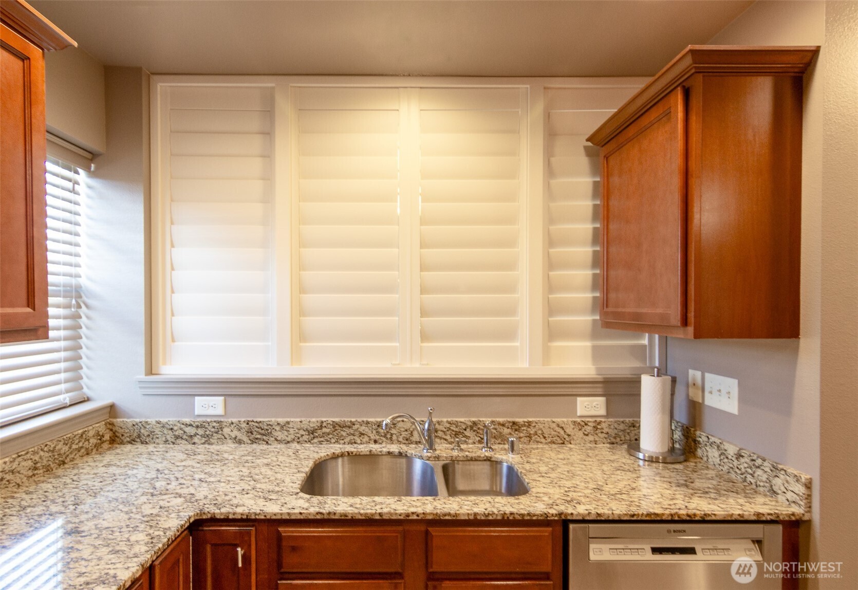 5686 Correll Drive, Unit 101 Ferndale, WA 98248 - Photo 6 of 22 a kitchen with granite countertop sink and window