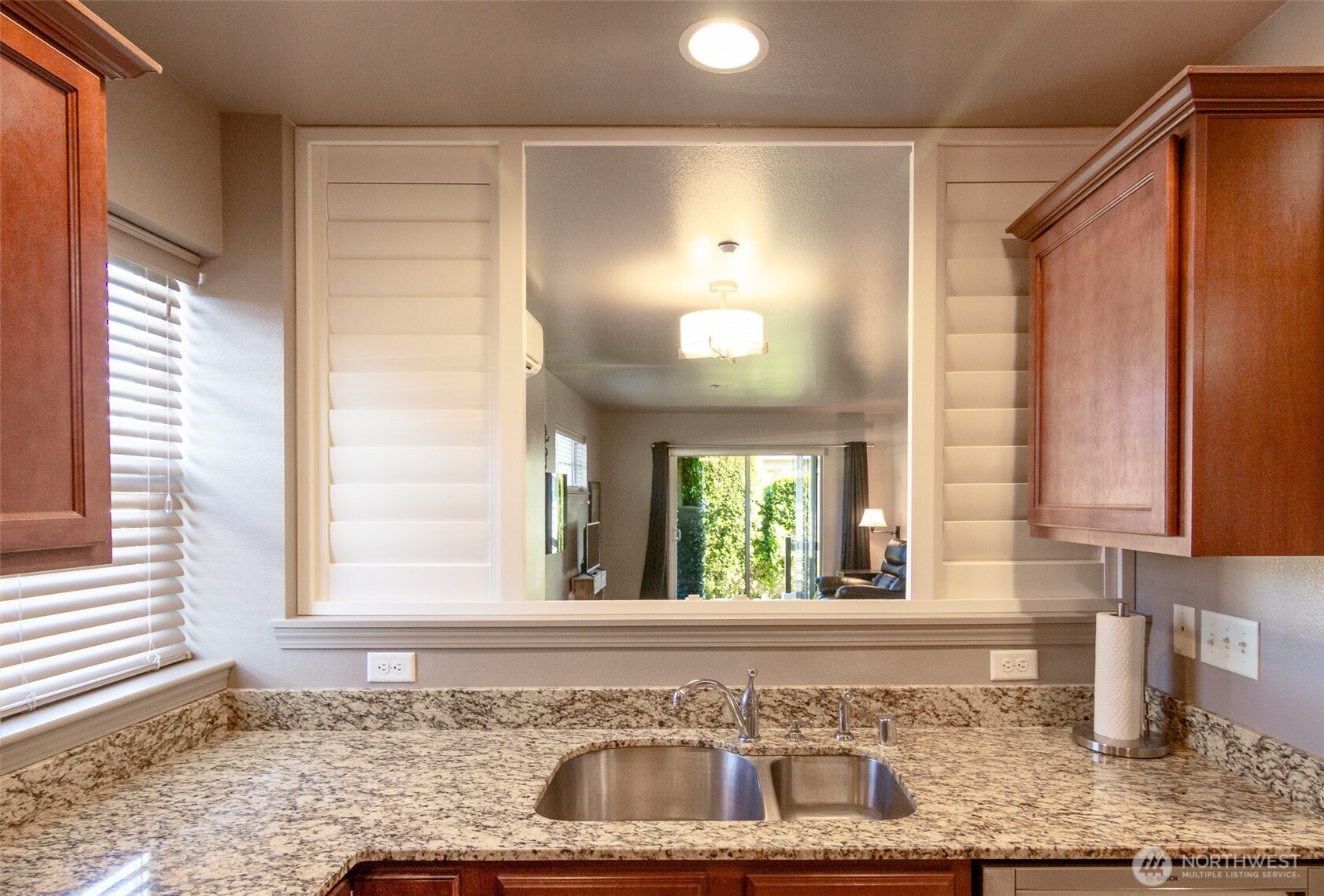 5686 Correll Drive, Unit 101 Ferndale, WA 98248 - Photo 7 of 22 a bathroom with a granite countertop sink and a window
