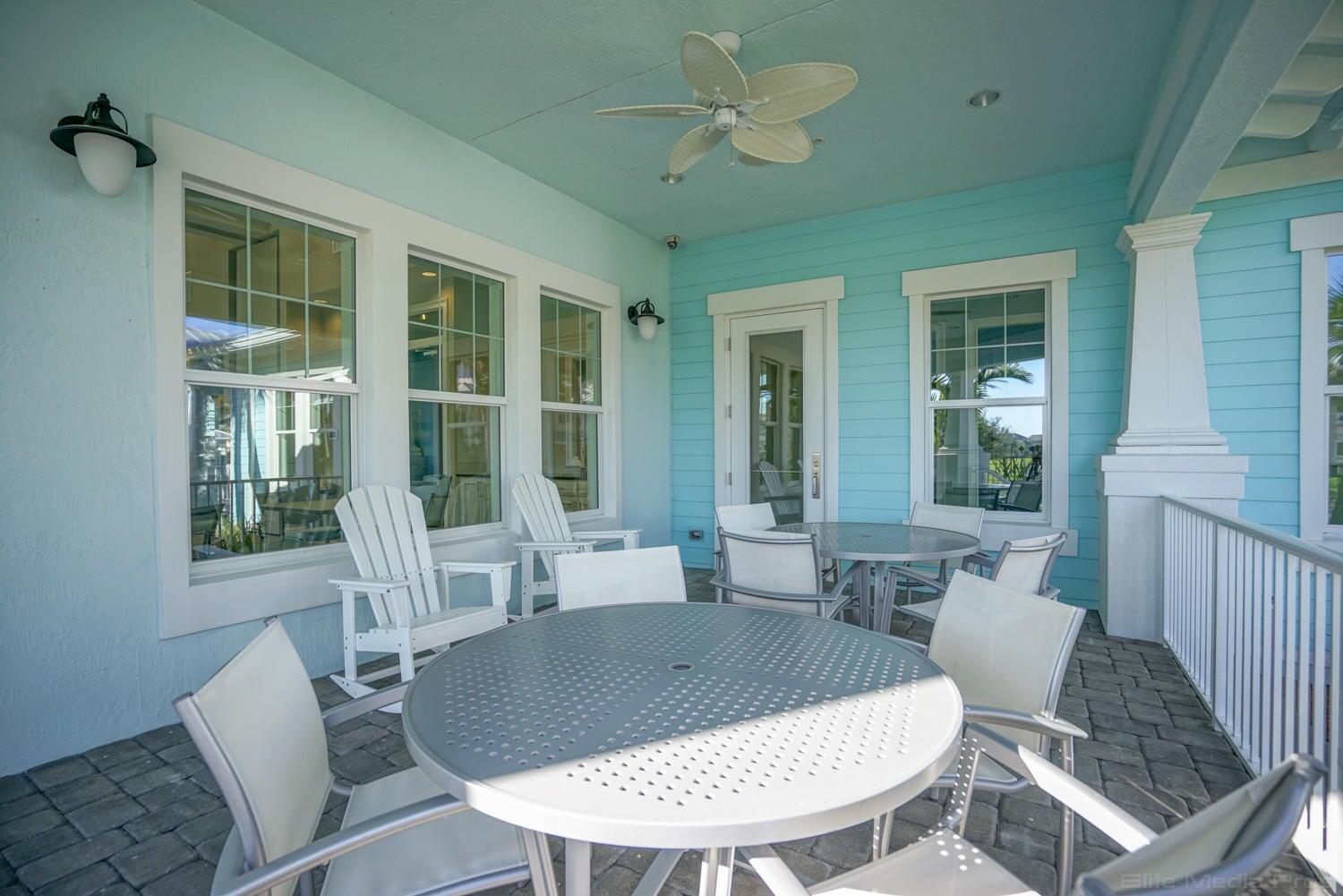 1132 South Community Drive Jupiter, FL 33458 - Photo 13 of 20 a view of a dining room with furniture window and wooden floor