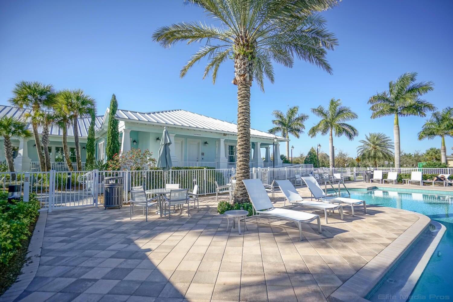 1132 South Community Drive Jupiter, FL 33458 - Photo 14 of 20 a view of a patio with swimming pool and sitting area