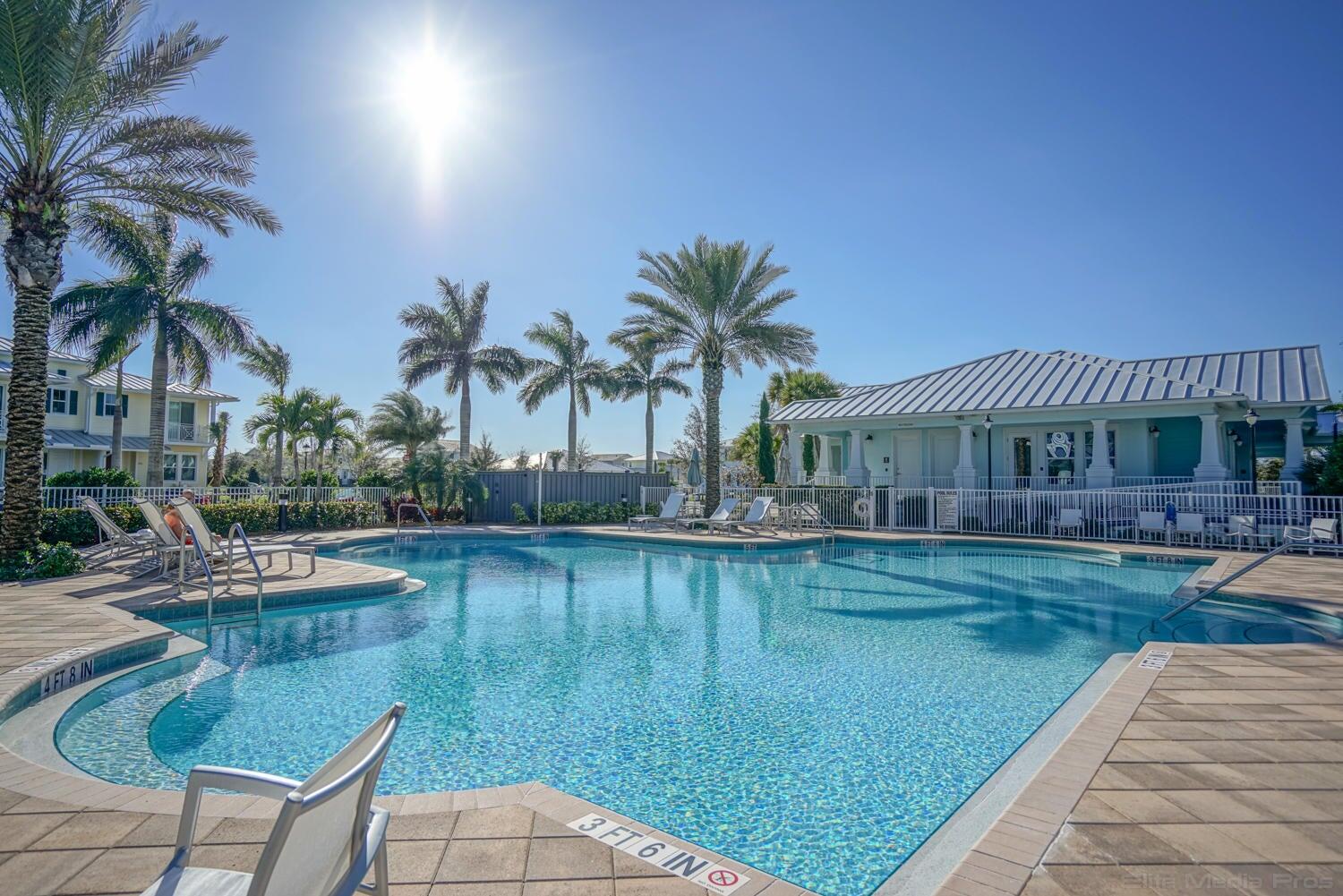 1132 South Community Drive Jupiter, FL 33458 - Photo 15 of 20 a swimming pool with outdoor seating and yard