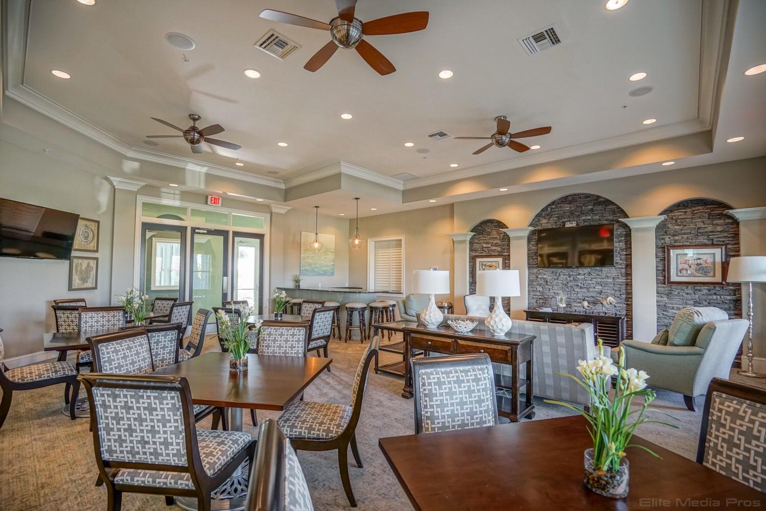 1132 South Community Drive Jupiter, FL 33458 - Photo 17 of 20 a living room with fireplace furniture and a potted plant