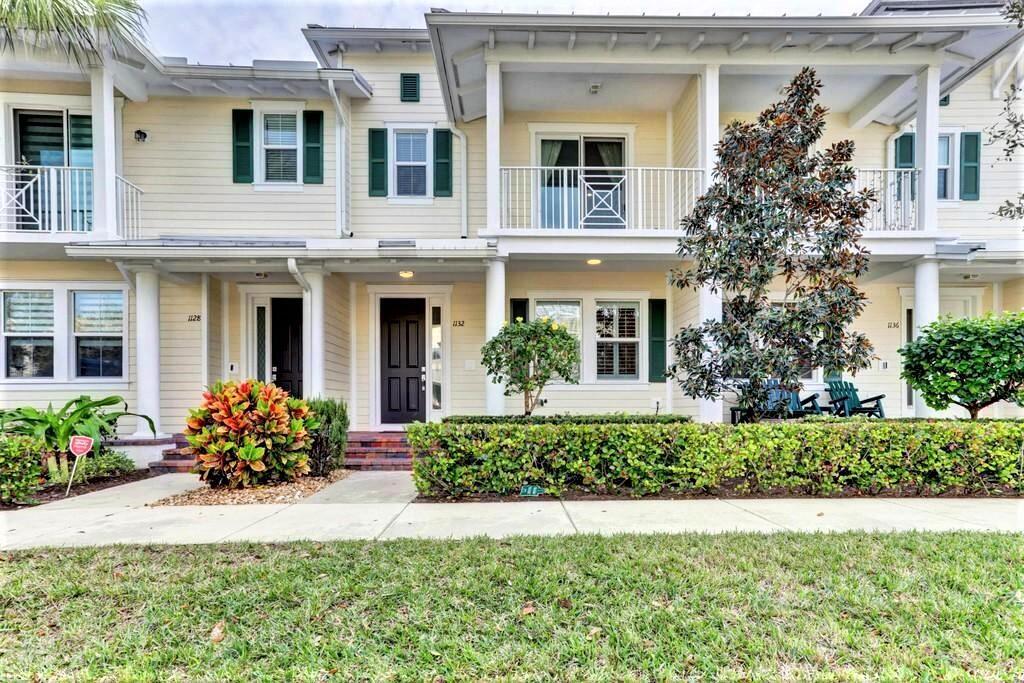1132 South Community Drive Jupiter, FL 33458 - Photo 2 of 20 a front view of a house with a yard