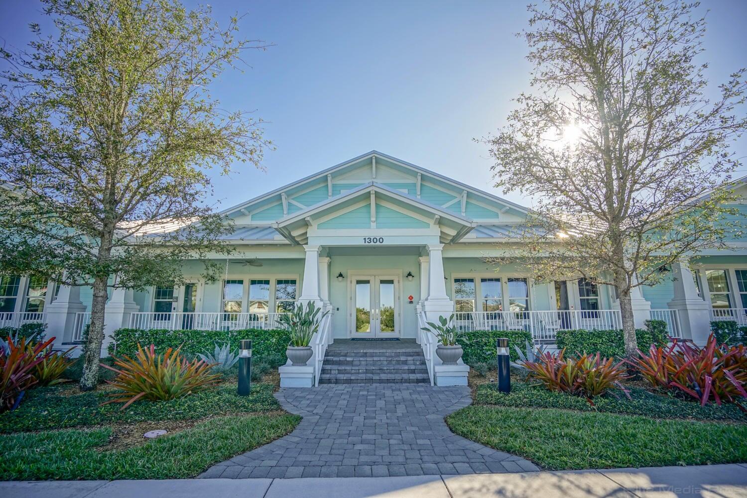 1132 South Community Drive Jupiter, FL 33458 - Photo 10 of 20 a front view of a house with garden