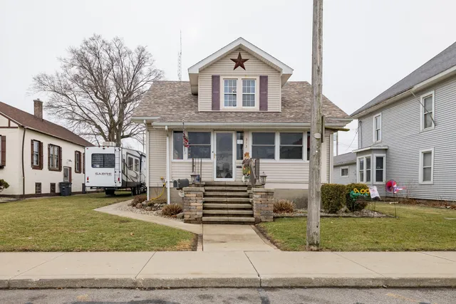 a front view of a house with a yard