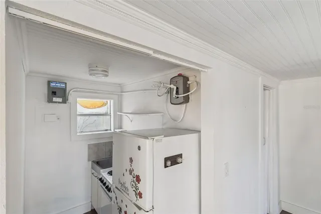 a room with a sink and a mirror