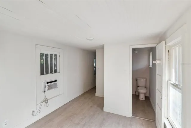 a view of kitchen and hallway with closet