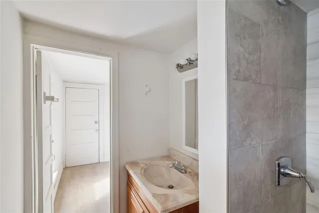 a bathroom with a sink and shower