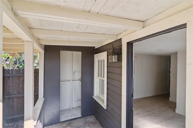a view of entryway with wooden floor and stairs