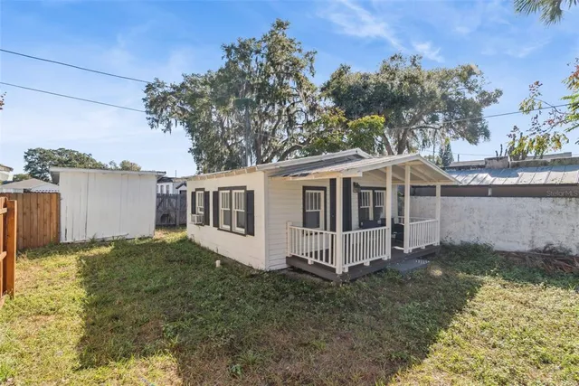 a house with trees in the background