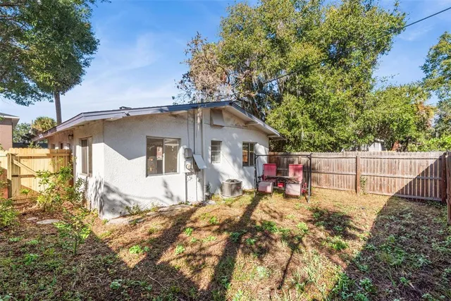 a house view with a outdoor seating