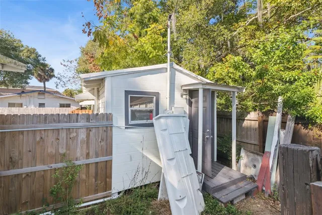 a view of outdoor kitchen and outdoor seating
