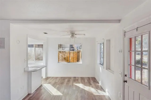 a view of an empty room with a window