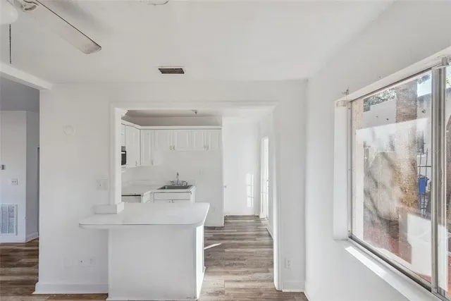 a bathroom with a sink mirror and shower