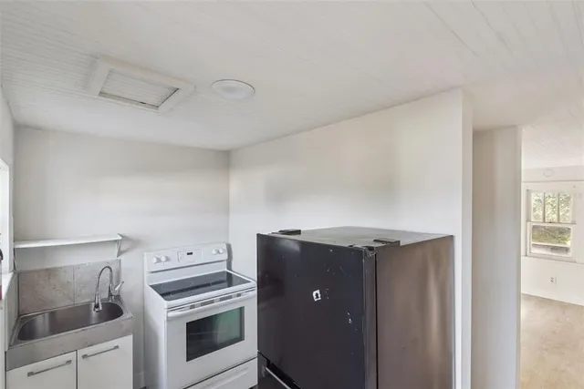 a view of a kitchen with washer and dryer