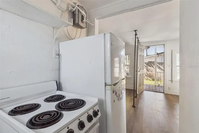 a kitchen with a stove and a refrigerator