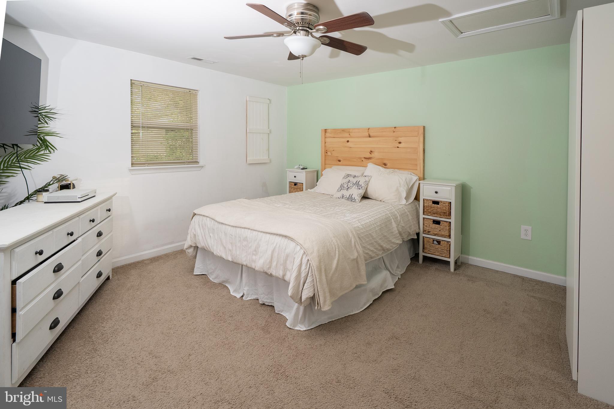1816 Cremen Road Pasadena, MD 21122 - Photo 11 of 46 a bedroom with a bed and a window