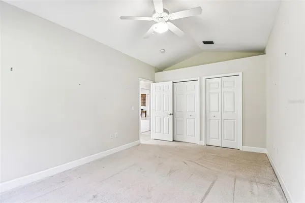 a kitchen with white cabinets