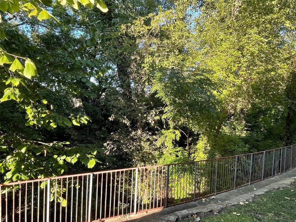 8545 Midpark Road, Unit 11 Dallas, TX 75240 - Photo 13 of 19 a view of balcony with wooden floor