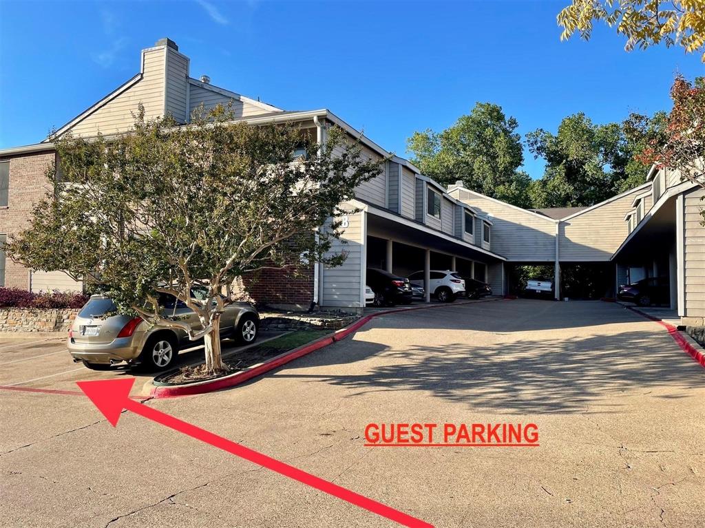 8545 Midpark Road, Unit 11 Dallas, TX 75240 - Photo 18 of 19 a view of a street with cars