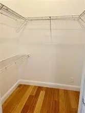 a bathroom with a granite countertop sink a toilet and bathtub