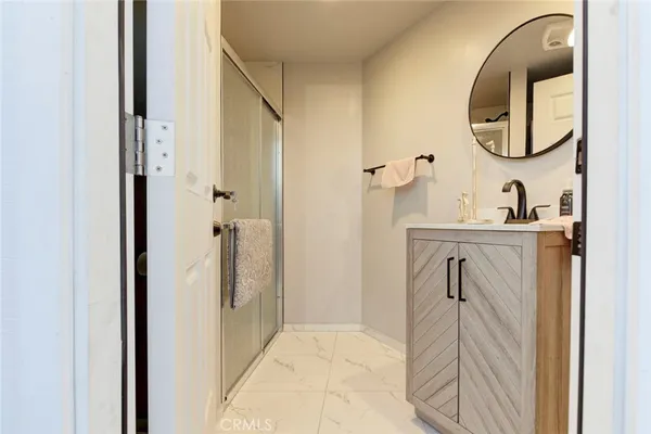 a bathroom with a sink and a mirror