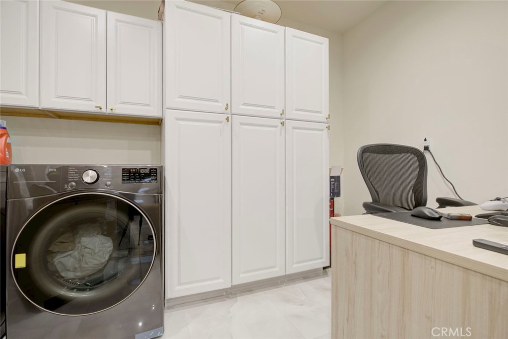 10263 Strathern Street Sun Valley, CA 91352 - Photo 18 of 19 a utility room with dryer and washer