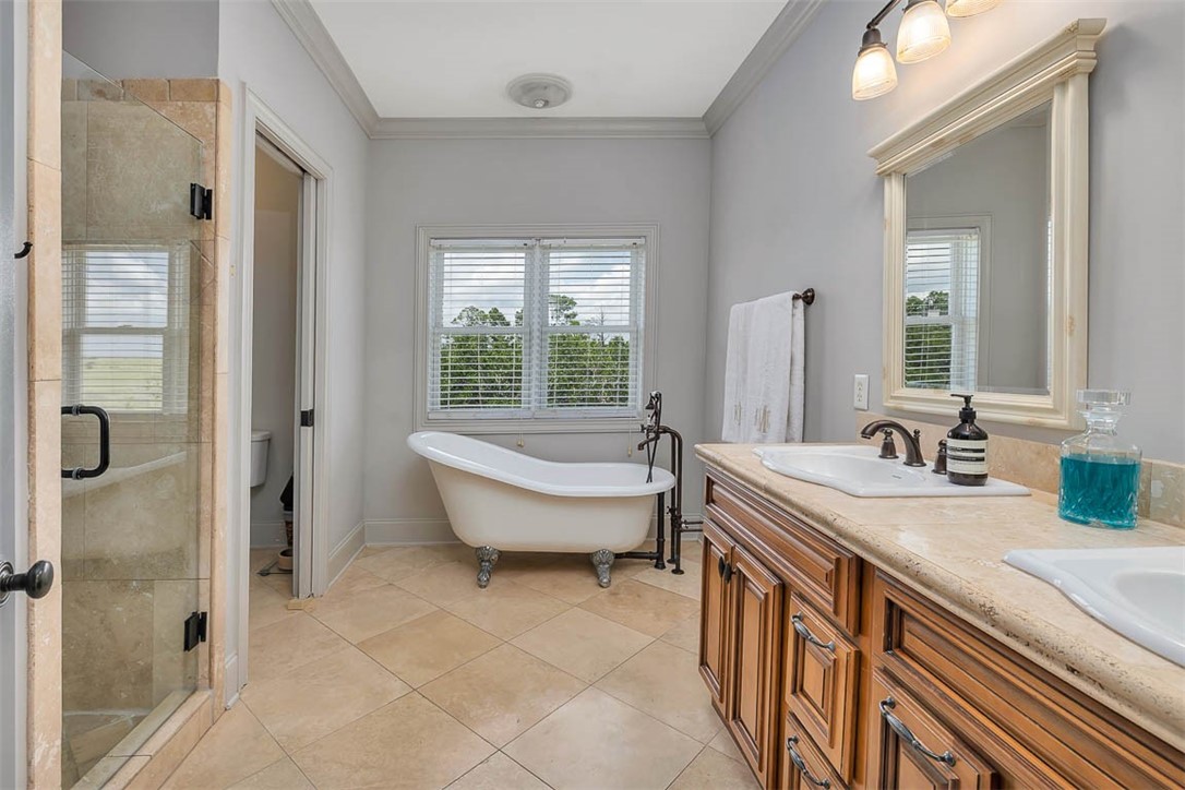 295 McIntosh Avenue St. Simons Island, GA 31522 - Photo 25 of 77 Primary bathroom