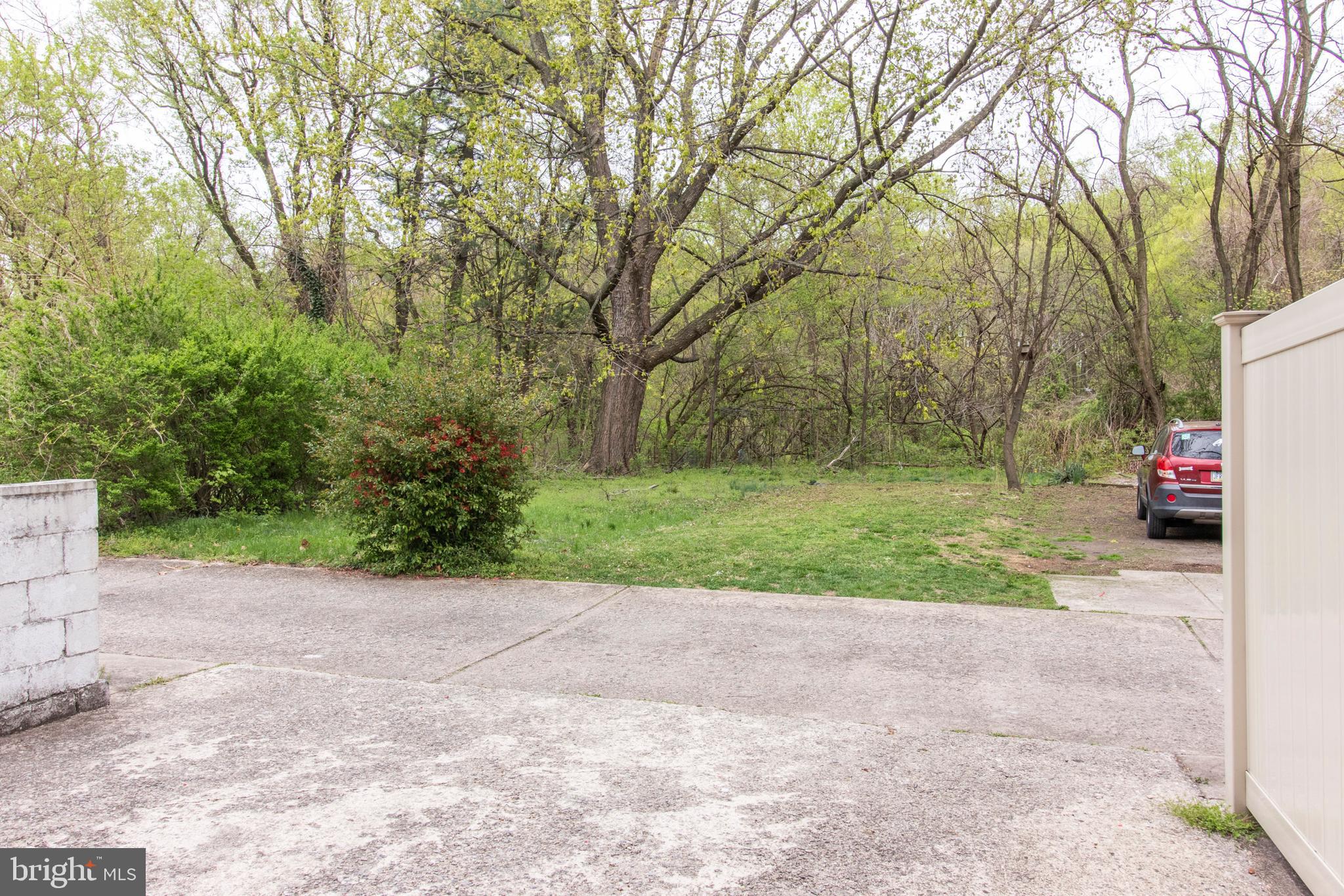2745 East Country Club Road Philadelphia, PA 19131 - Photo 31 of 34 Driveway - and backyard abutting Fairmount Park