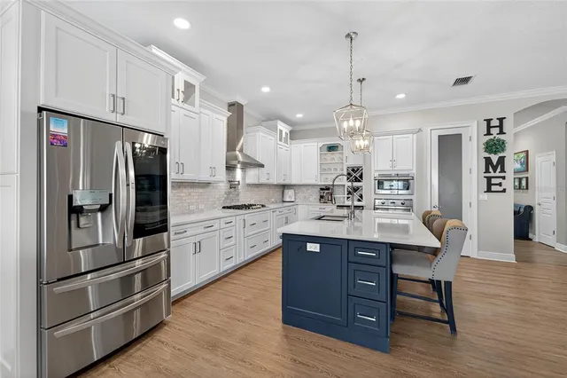 a view of a livingroom with workspace and a window