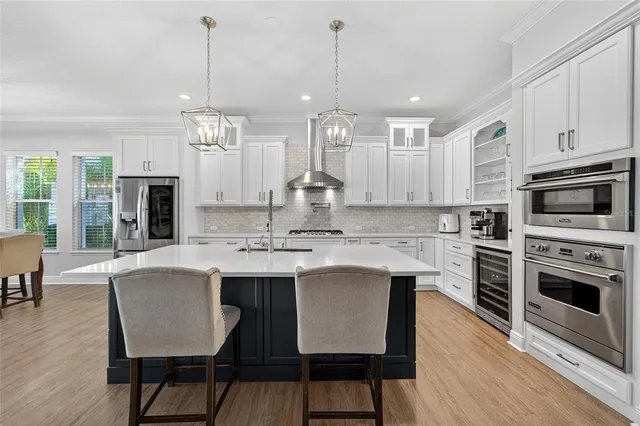 a large bedroom with a large bed and a large window