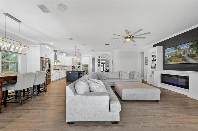 a view of a livingroom with furniture and a flat screen tv