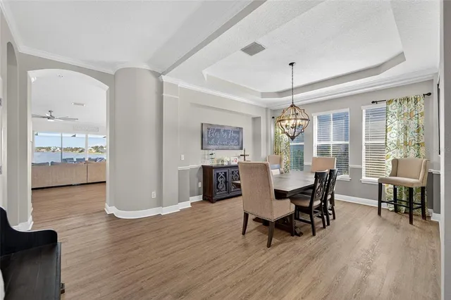a bathroom with a granite countertop double vanity sink and mirror