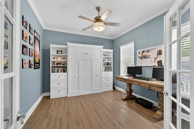 an aerial view of a house with a garden and lake view