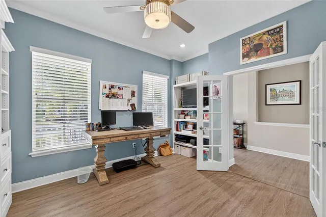 an aerial view of a house with a garden and lake view