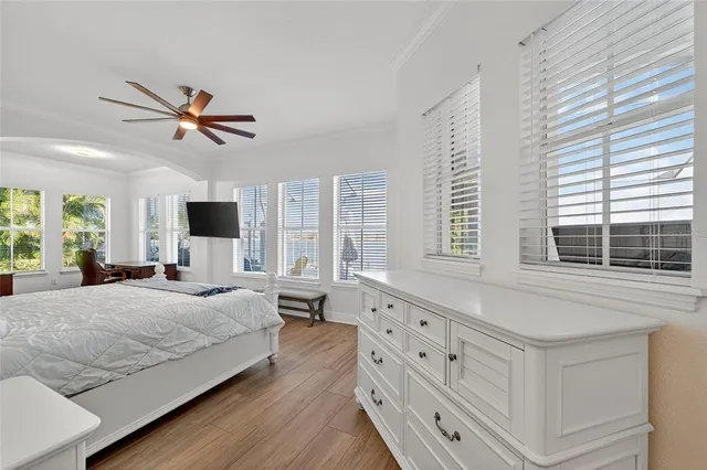 a view of a porch with a floor to ceiling window and wooden floor